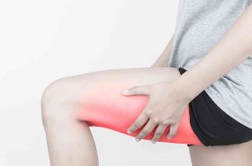 Young woman with pulled hamstring. Hamstring pain after sport playing.